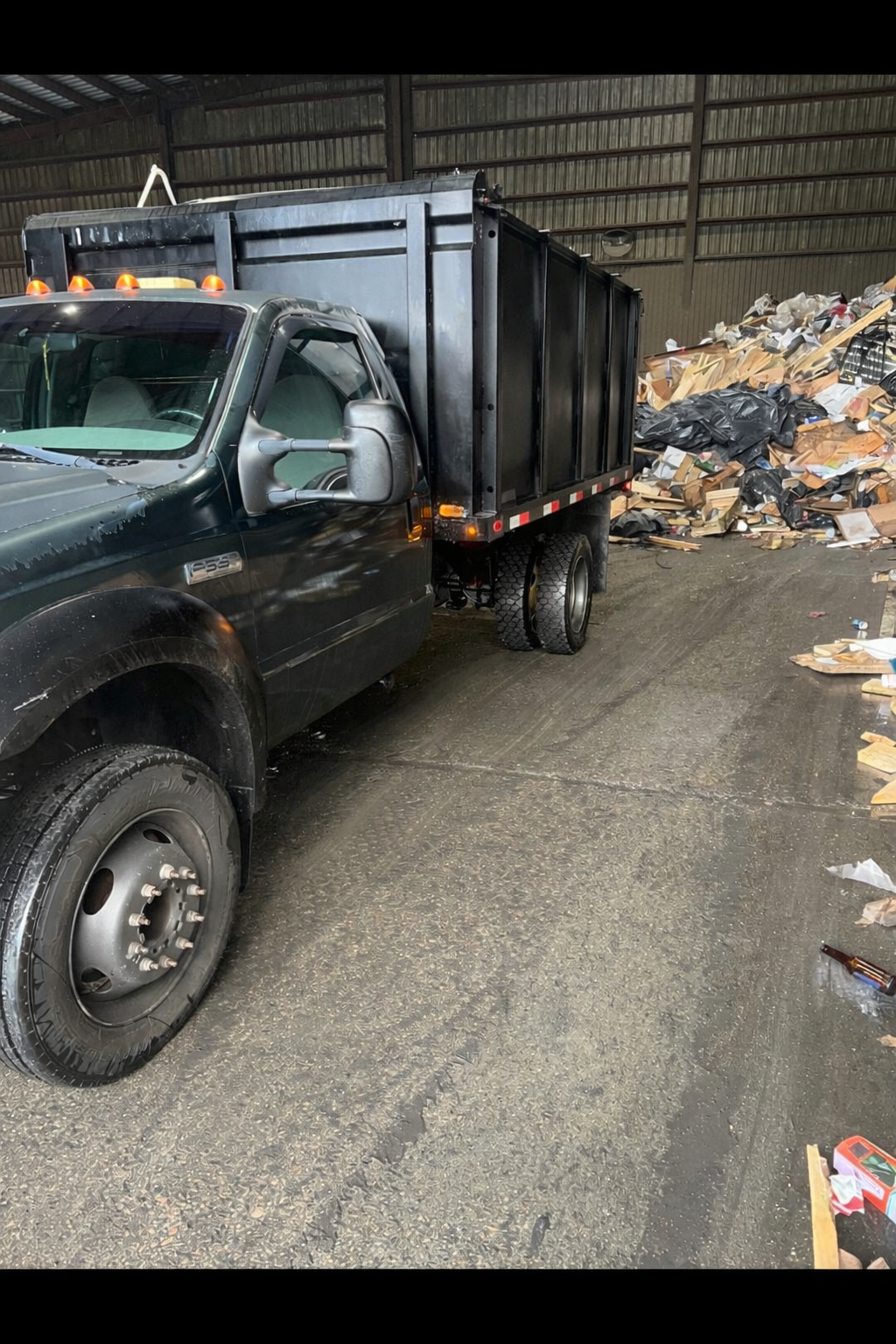 CJ Junk Removal truck at dump site